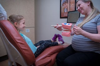 Kids Dentist Langley - image of little girl in dentist chair